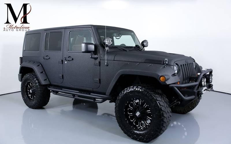 Used 2013 Jeep Wrangler Unlimited Sport 4x4 4dr SUV for sale Sold at Metrolina Auto Group in Charlotte NC 28217 - 1