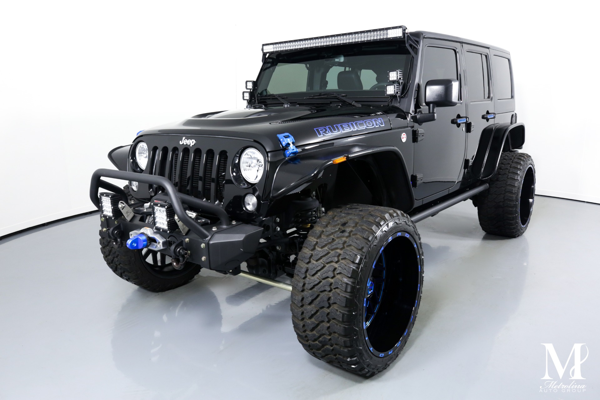 Used 2014 Jeep Wrangler Unlimited Rubicon for sale $46,996 at Metrolina Auto Group in Charlotte NC 28217 - 4