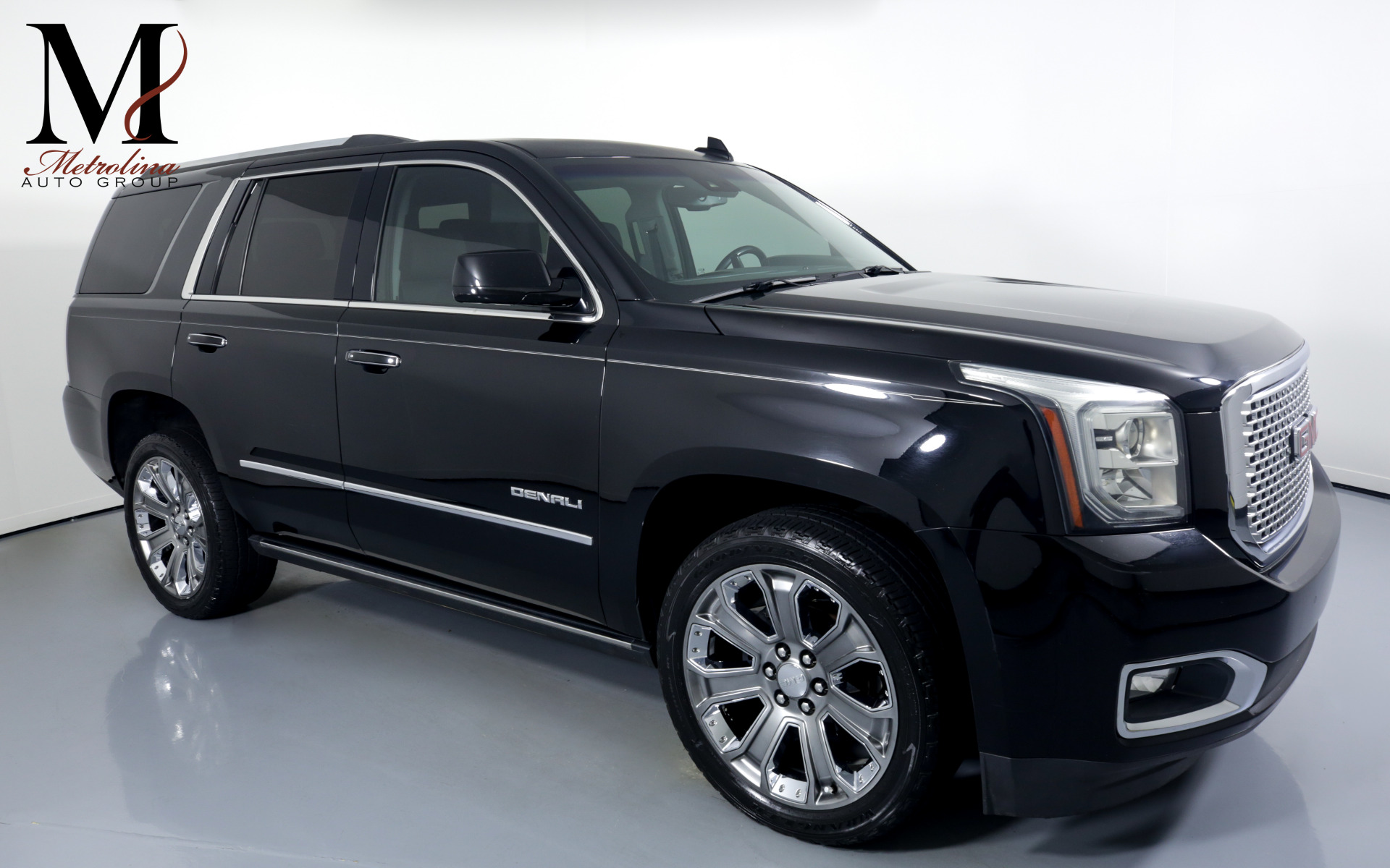 Used 2015 GMC Yukon Denali for sale $44,996 at Metrolina Auto Group in Charlotte NC 28217 - 1