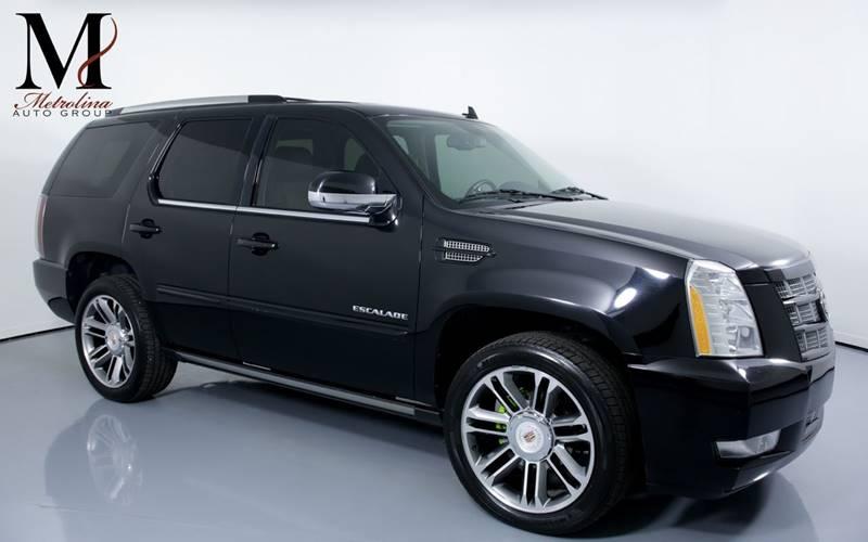 Used 2012 Cadillac Escalade Premium AWD 4dr SUV for sale Sold at Metrolina Auto Group in Charlotte NC 28217 - 1